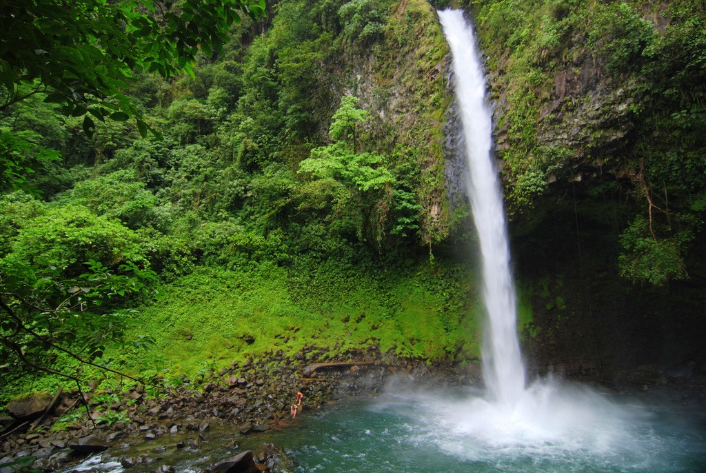 This is a memory waiting to be made. Swimming Holes Image: La Fortuna Waterfall cascades into the swimming hole beneath it.