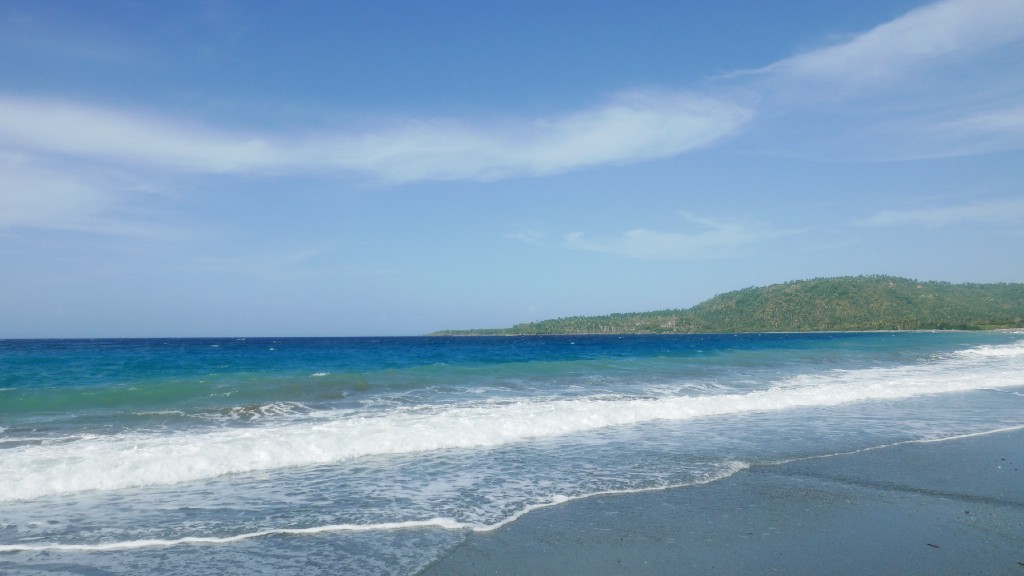 Waiting for the waves to break? Take a moment to admire the view. Best Surfing Beaches: A photograph of Cuba's beautiful and calm beach; the waves have yet to break.