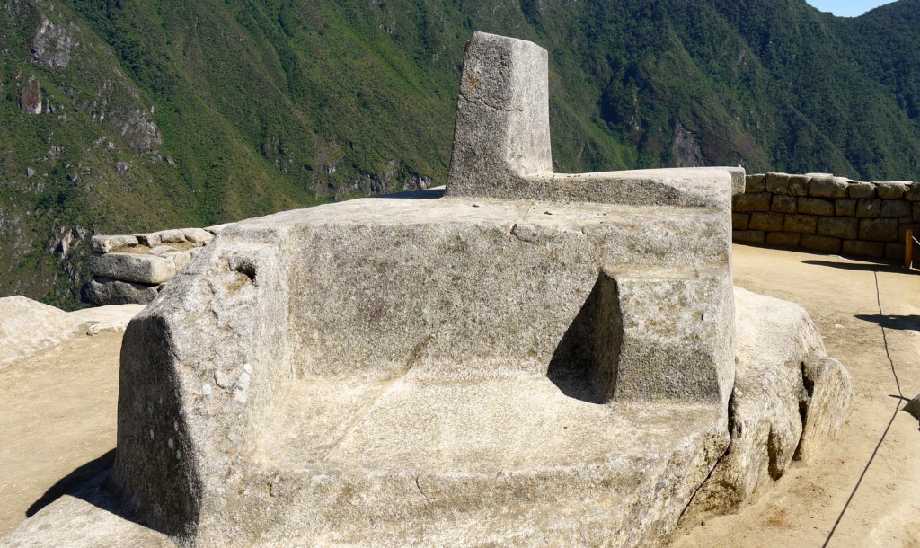 What time is it? Time to explore mysterious destinations! Mystical Destinations Image: A photograph of an oversized stone solar clock (or sundial) is augmented by a mountainous background.