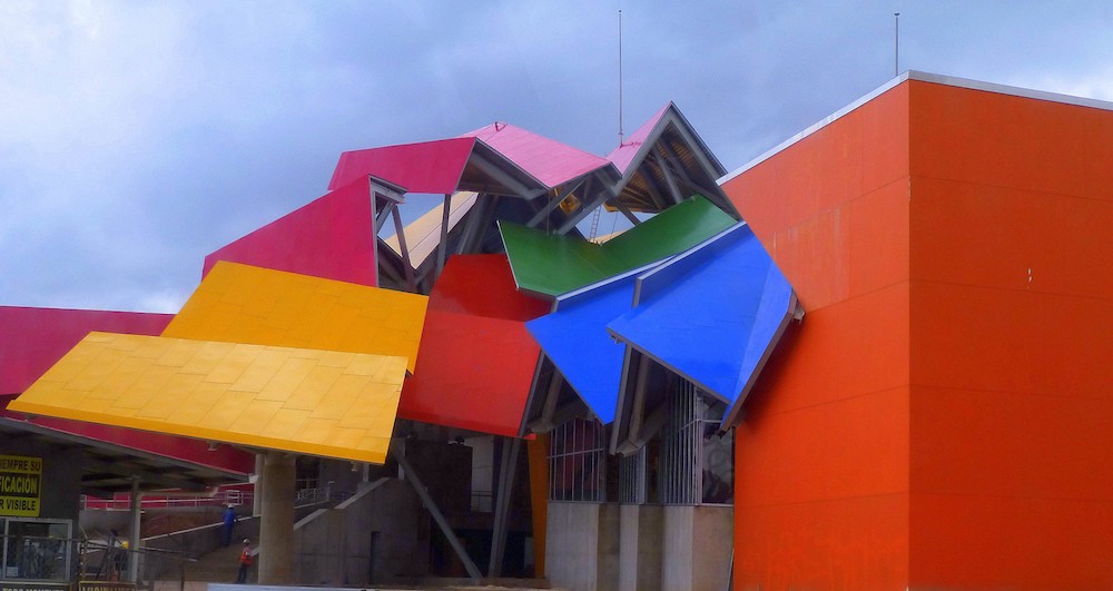 Did you guess that this was a Gehry? Architecture In Panama Image: An angle of Panama's Frank Gehry designed building shows yellow, magenta, pink, blue, red, and green surfaces at different angles and compositions.