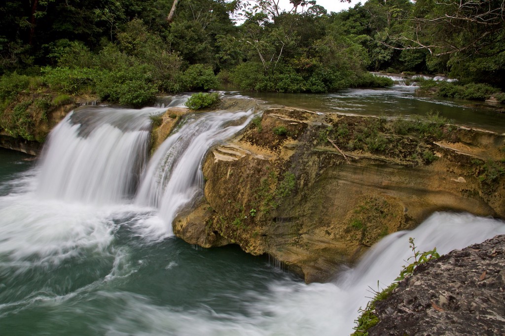 Take in these beauty of these falls—a change of pace from Belize's crystal clear seas. Swimming Holes Image: A photograph of the rocky and rushing Río Blanco waterfalls.
