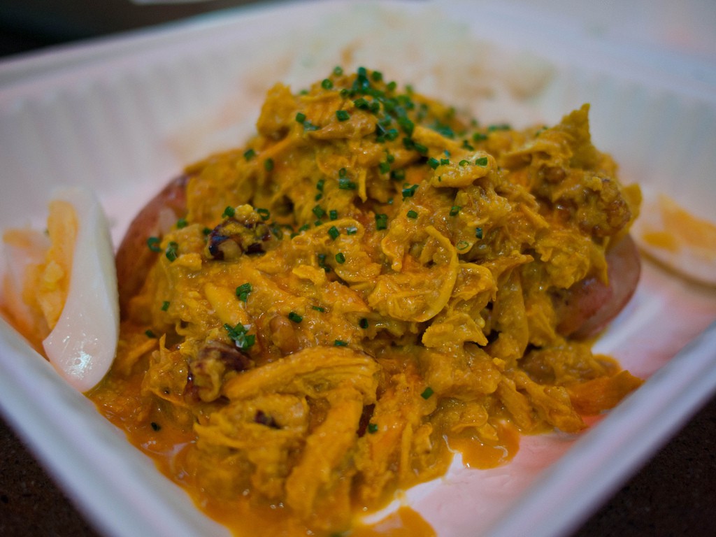 So many delicious chicken dishes in the world; so little time to eat them all. Visit Peru Image: A hard-boiled egg is sliced in half beside the creamy chicken dish this section of our Peru food tour list describes.