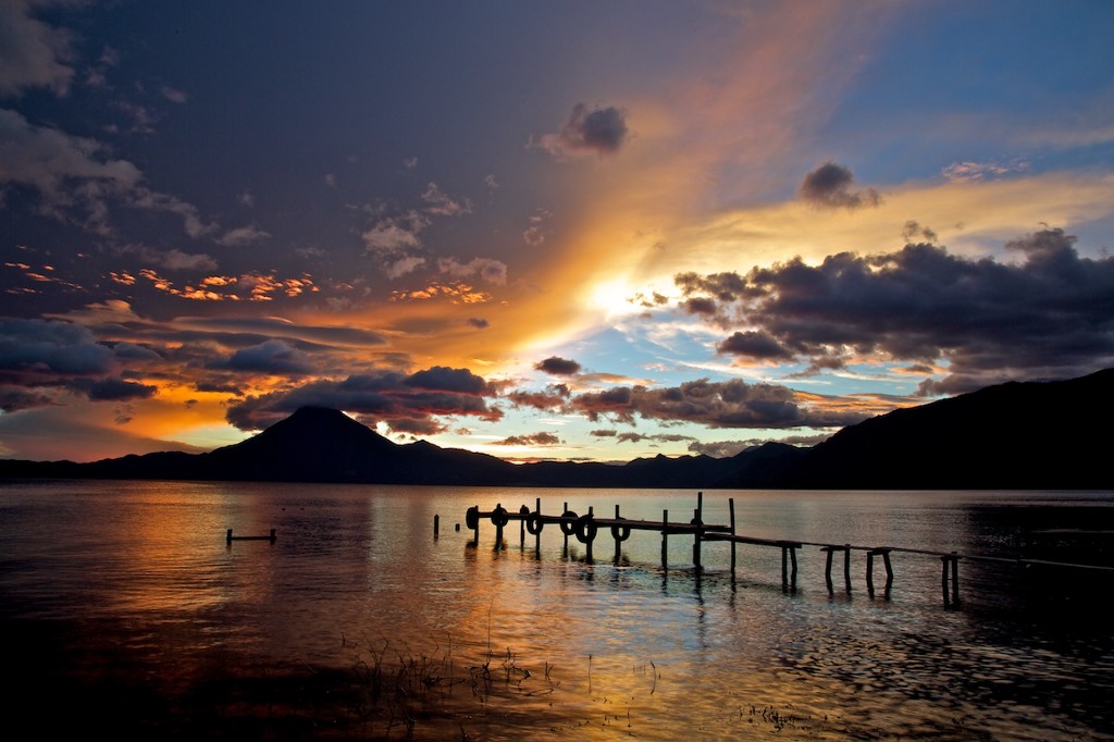 The mystery of this destination is how a lake can be so beautiful. Mystical Destinations Image: An image of Lake Atitlán is caressed by low light.