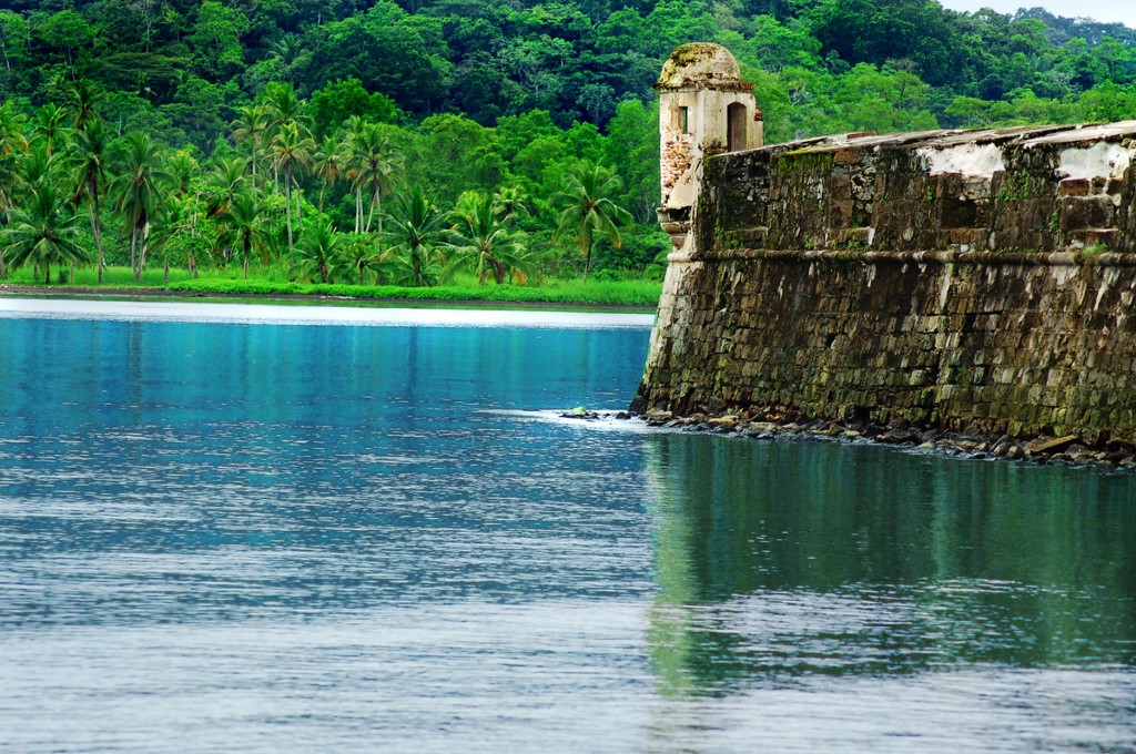 Be on the lookout—for amazing scenery. Architecture In Panama Image: A fort aged and in the early stages of being reclaimed by natures has openings which overlook calm blue waters, and a vivd green forest.
