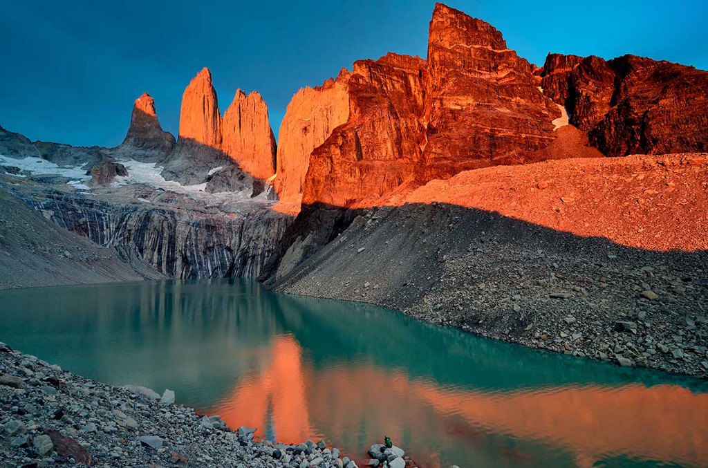 Be sure to have a sketchbook or camera ready at all times. Destinations Worth Dreaming Image: A mountain scene displays the colours of nature in rocks, dusty peaks, and flowing water.