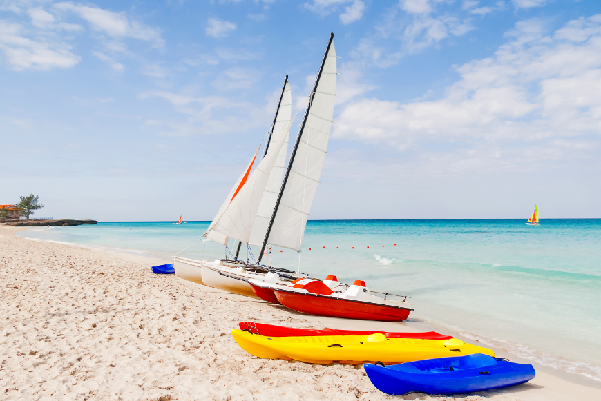 Enjoy the beach, but make sure you leave a little time to explore Cuba's waters too! Are Cuba's Beaches Nice Image: Colorful boats line the shore of a Cuban beach.