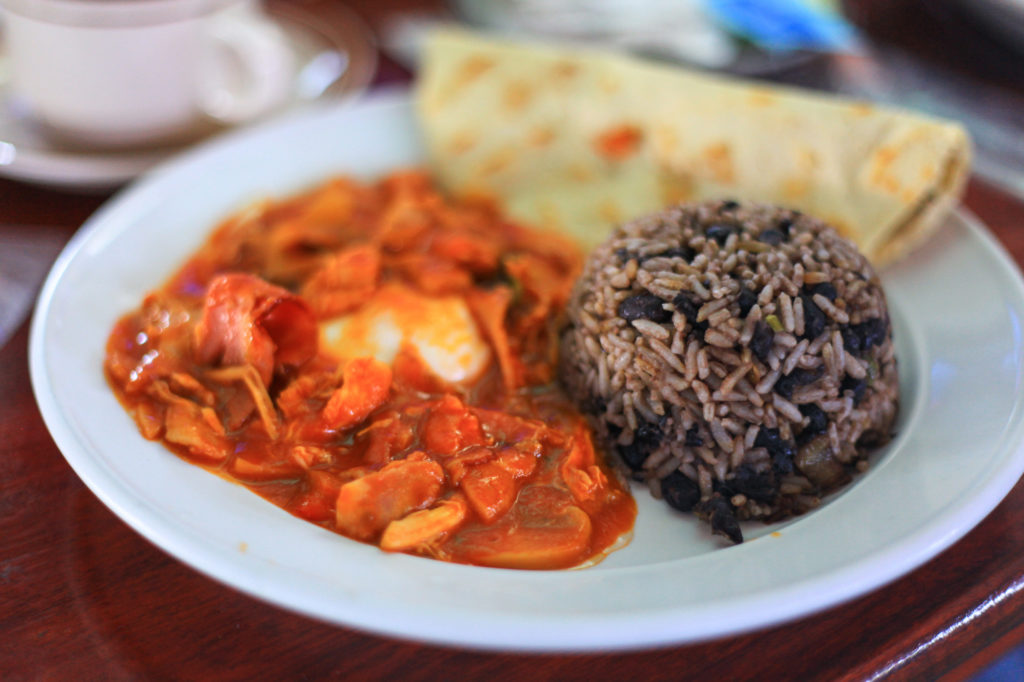 Costa Rican Foods Image: Gallo pinot (black beans and rice) on a plate with additional breakfast foods.