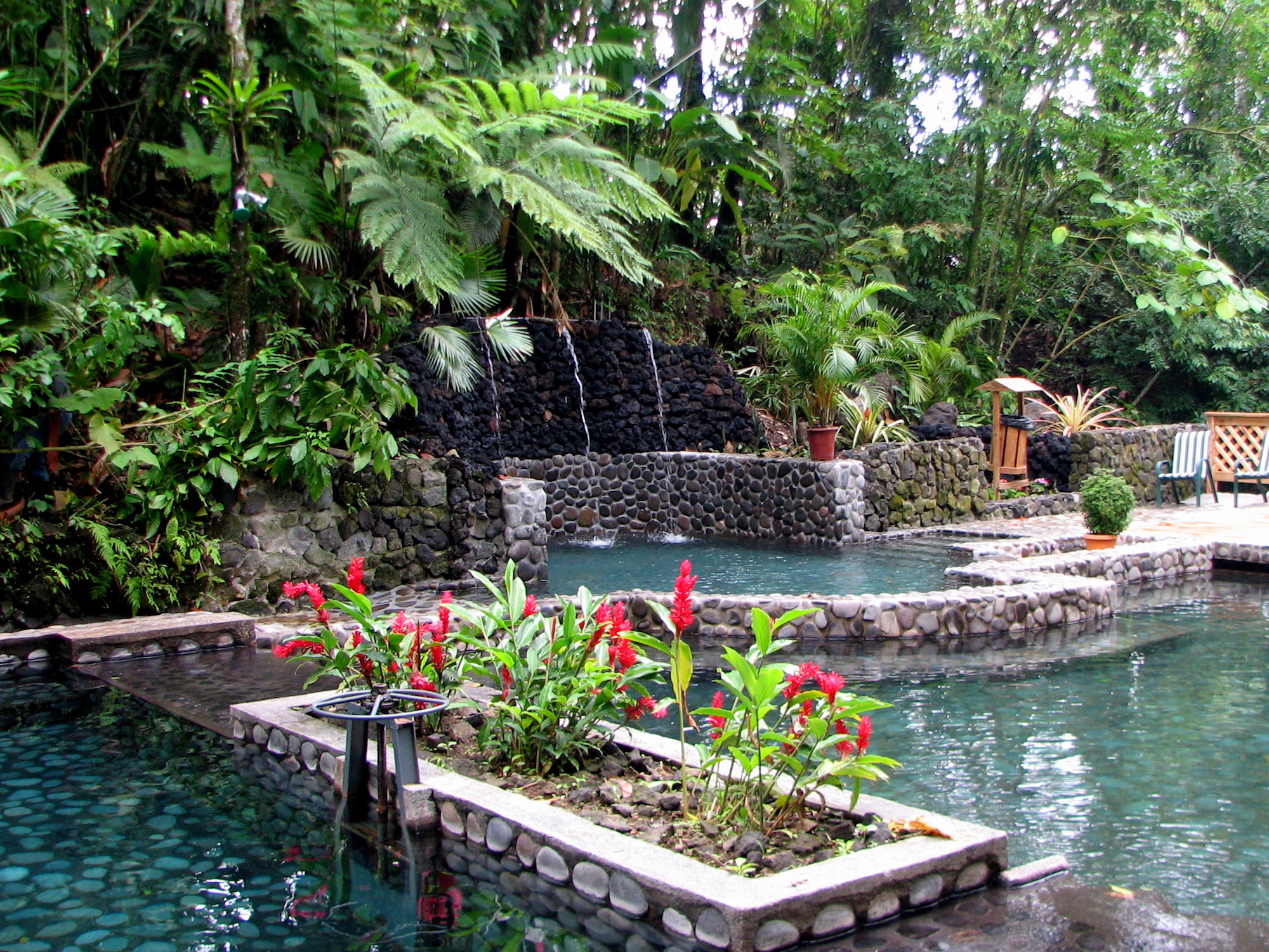 For those moments when you're soaking with your eyes open, you have this lovely setting to observe. Hot Springs Image: Eco Termales Hot Spring Costa Rica. Stone pools, water features, plants and flowers surround the pools of Eco Termales.