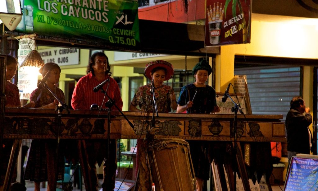 Outdoor music on a sultry night. Guatemala Dream Vacation: A musical group plays outdoors on a sultry night.