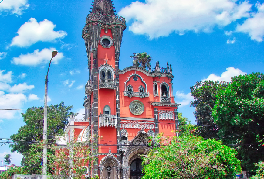 Even if you aren't religious, you can appreciate the beauty and craftsmanship of this structure. Belize and Guatemala Itinerary Image: The ornate coral colored Iglesia Yurrita.