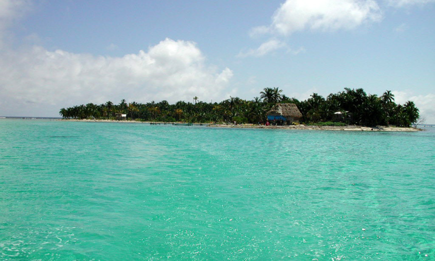 Belize Island Image: A view of Glover's Reef Atoll from a distance—the water is the star.