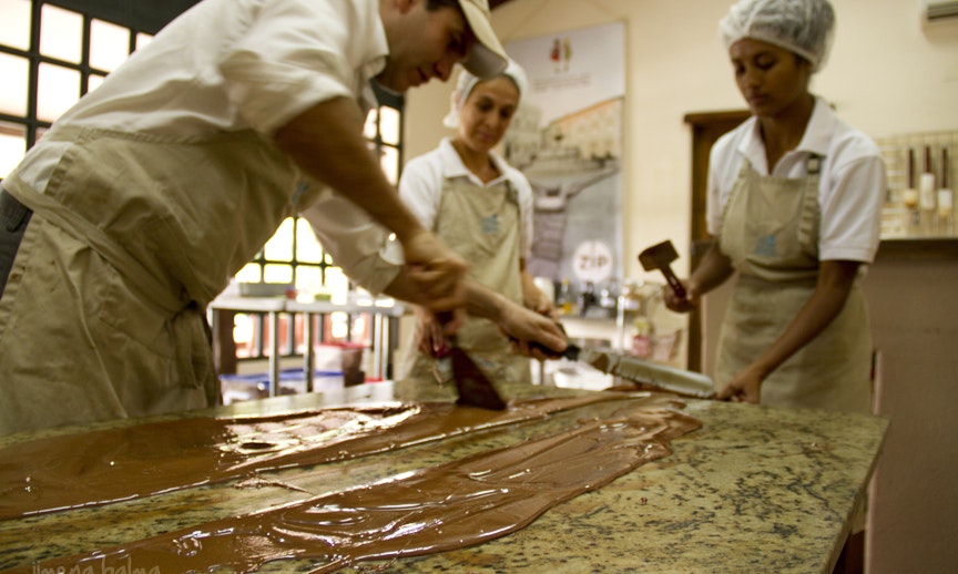 This may look easy, but that's because they're professionals. Best Chocolate Image: Three Sibú Chocolate makers pour and spread out their in-house chocolate.