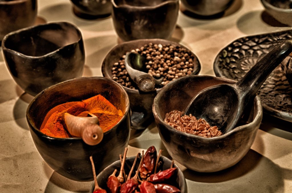 The chocolate of yesterday was much spicier, and not nearly as sweet, as the chocolate of today. Best Chocolate Image: Old pottery bowls with scoops are filled with chili peppers, paprika, allspice, and what is possibly anise seed or cacao nibs.