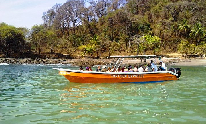 Best Ecotourism Lodges Image: A group enjoys a floating safari aboard the 'Tortuga Express.'