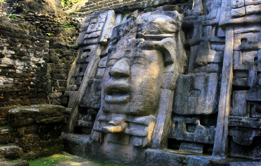 Ancient ruins reveal amazing craftsmanship at every turn. Central and South American Ruins Image: An oversized statue of a face is carved into a larger structure.