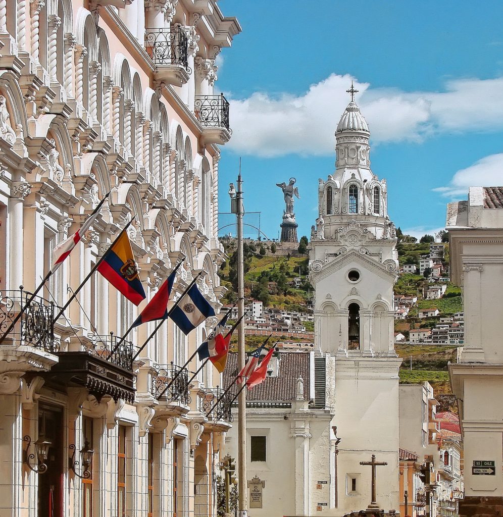 On your travels, take time to appreciate all of the sights—including the buildings you pass. Best Time To Visit South America Image: A church with a white exterior stands pristine against a blue and white sky.