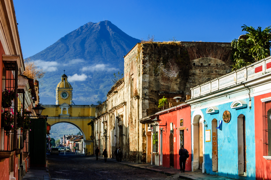 It may be cold in the United States, Canada, and Europe, but it's not cold everywhere! Central America in Winter Image: A volcano seen through the archway of a Spanish-Colonial street.