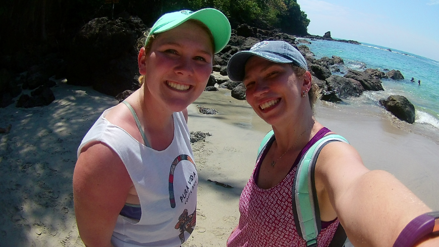 Hopefully, the ladies were able to take a bit of sunshine with them to the Midwest! Costa Rica Mother's Day Image: The author's daughter and granddaughter smile in tank tops and baseball caps on one of Manuel Antonio National Park's beaches.