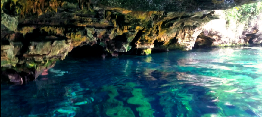 Diving In Belize Image: Entering an underground opening of Cenote Azul.