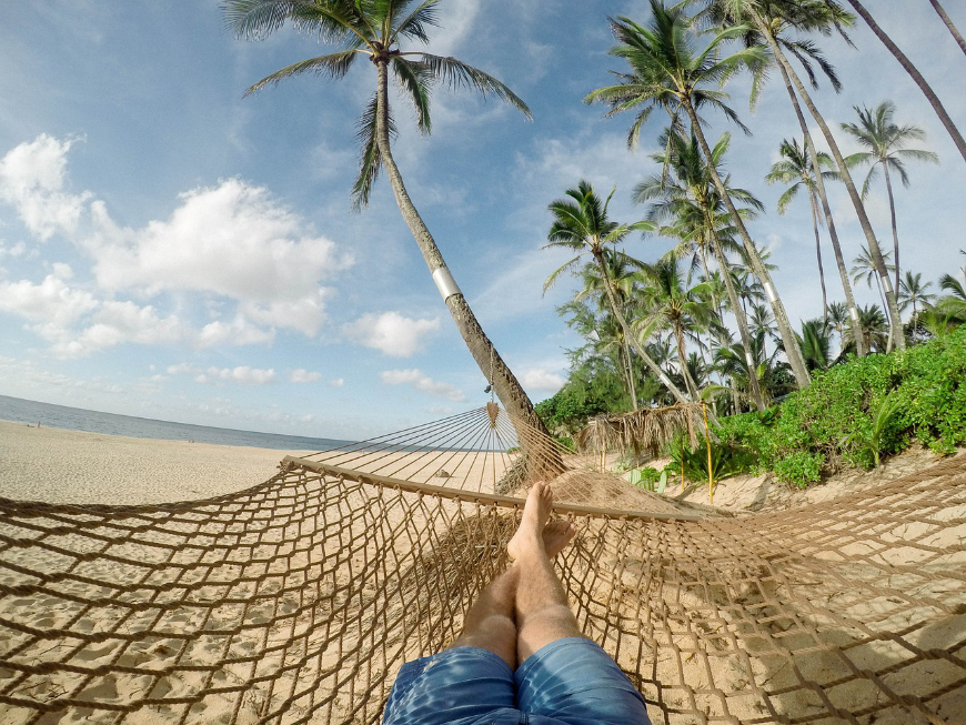 Napping during your holiday is optional, but highly recommended ;-) Diving In Belize Image: Point of view, a man's legs are extended in the hammock he lay in.