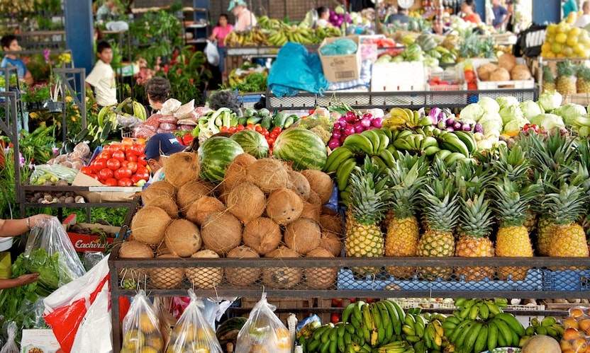 Soaking in a geothermal hot spring then indulging in fresh fruit? This holiday just keeps getting better. Hot Springs Image: Valle de Anton, Panama. A local market is stocked full of fresh produce; in the background are vegetables, but in the foreground are coconuts, bananas, pineapples, watermelons, and more.