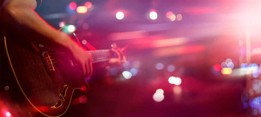 Discover the music the locals enjoy. Lima Nightlife Image: A guitarist on stage.