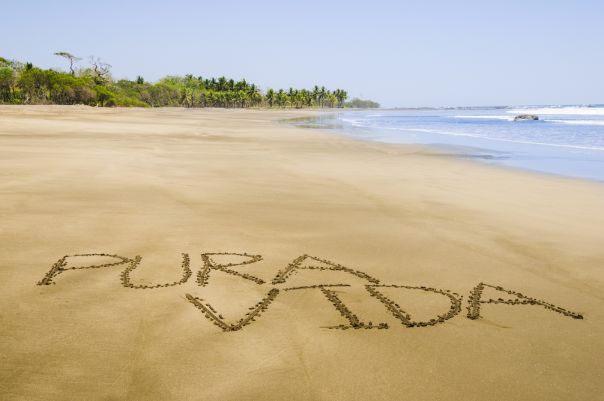 Make-A-Wish children live and embody 'Pure Life!' Make-A-Wish Costa Rica Image: Pura Vida is written in large letters in the sand on a beach.
