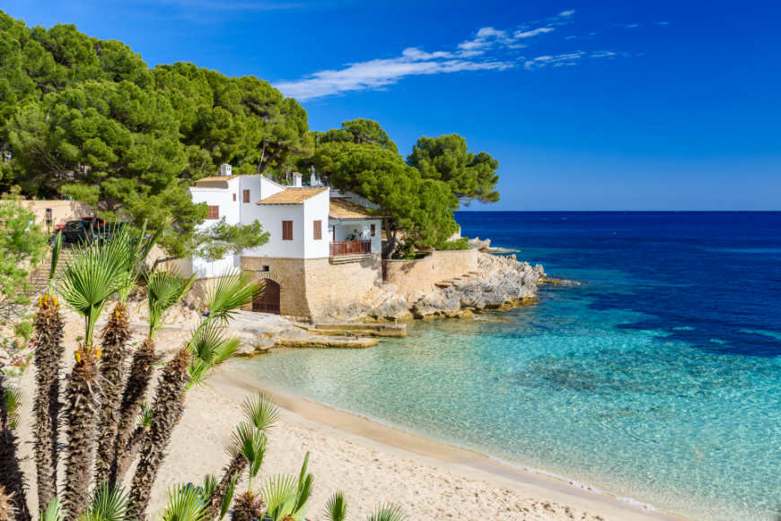Don't focus on where 'everyone goes,' focus on where YOU will be happiest. Moving Abroad Image: A picturesque home on the Mediterranean seaside.