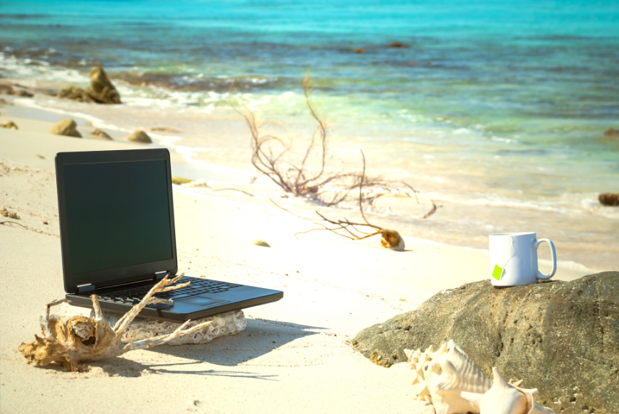 No matter where on Earth you go, you cannot escape paying taxes. Retiring Abroad, Moving Abroad Image: A laptop and a coffee mug are sitting on a sandy beach.