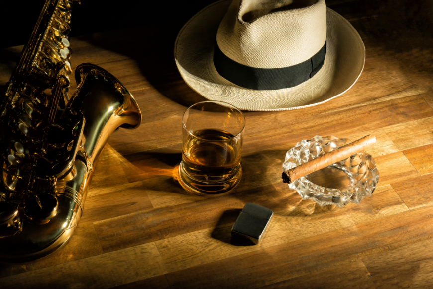 Sample a little bit of everything and have the quintessential Cuban experience. Salsa Dancing in Cuba Image: A Panama hat, saxophone, glass of rum, silver lighter, and cigar perched on crystal ashtray sit on a wooden bar.