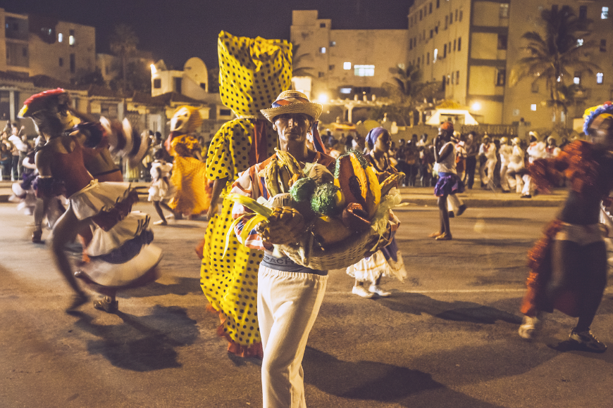 Dance the night away, then watch the sunrise. Salsa Dancing in Cuba Image: A nighttime scene from carnival—colorful dancing in the streets.