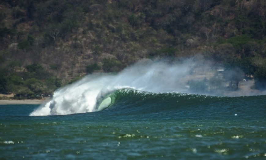 You won't find this during your average day at the office. Summer In Panama Image: A barreling wave rolls along.