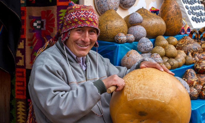 Such intricate beauty and expert craftsmanship. Sustainable Travel In Peru Image: A gentleman is intricately hand carving an oversized gourd.