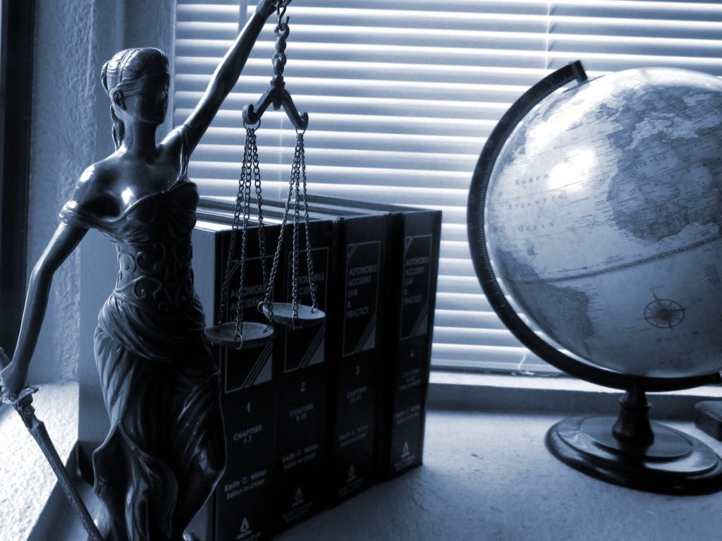If the laws change after you've booked your trip, you do have recourse. Legally Travel To Cuba Image: A black and white photo of the scales of justice, legal books, and a globe.