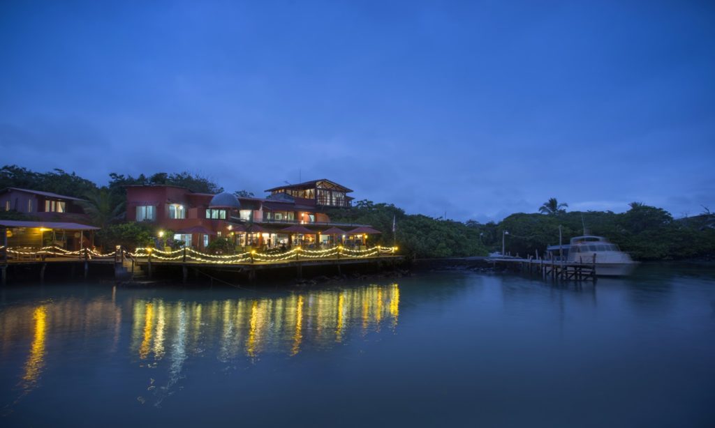 The Galápagos islands are waiting for you... Why Travel Insurance Is A Must Image: Red Mangrove Aventura Lodge at night.